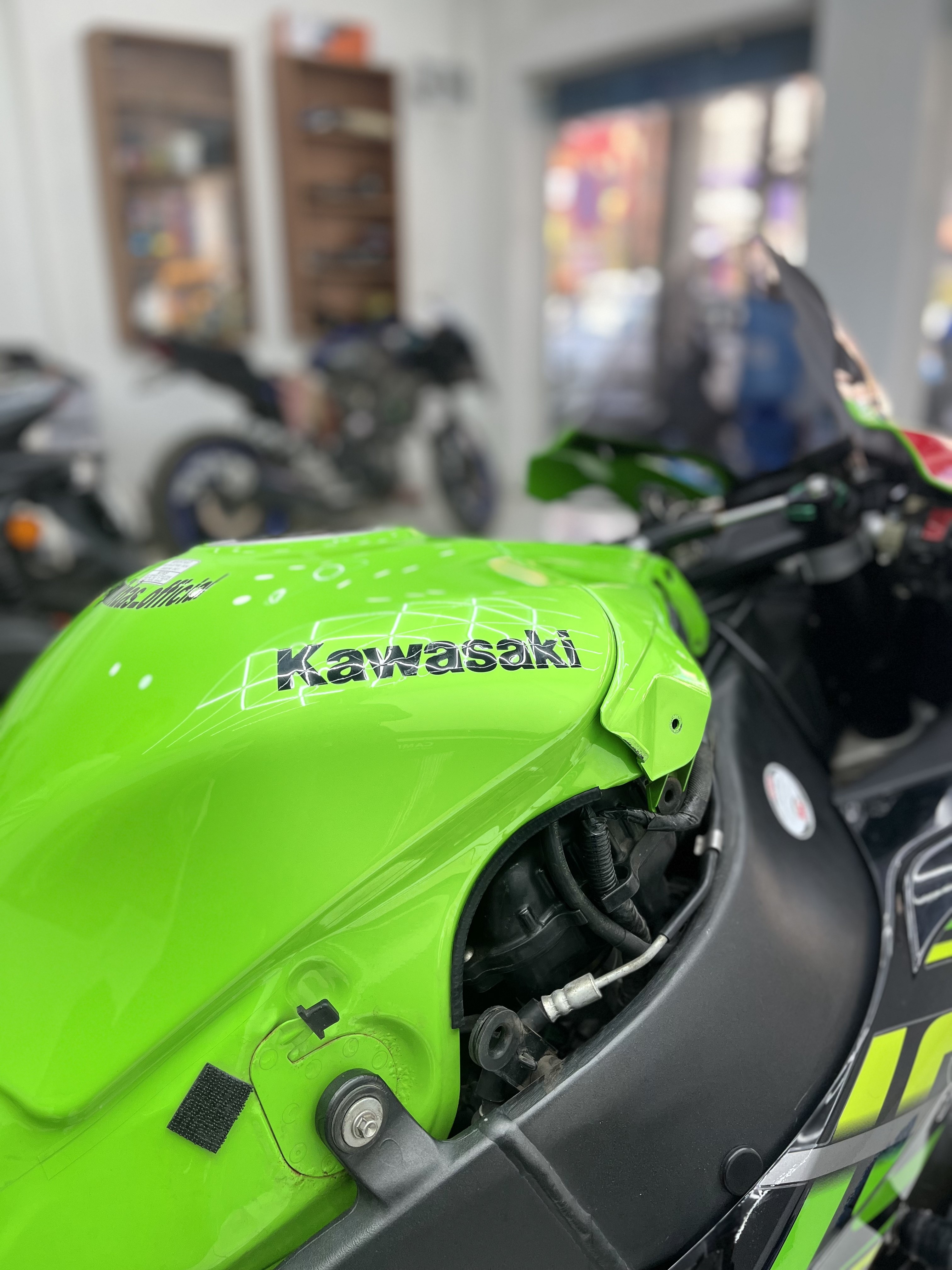 Kawasaki Ninja fuel tank close-up with gloss ceramic finish