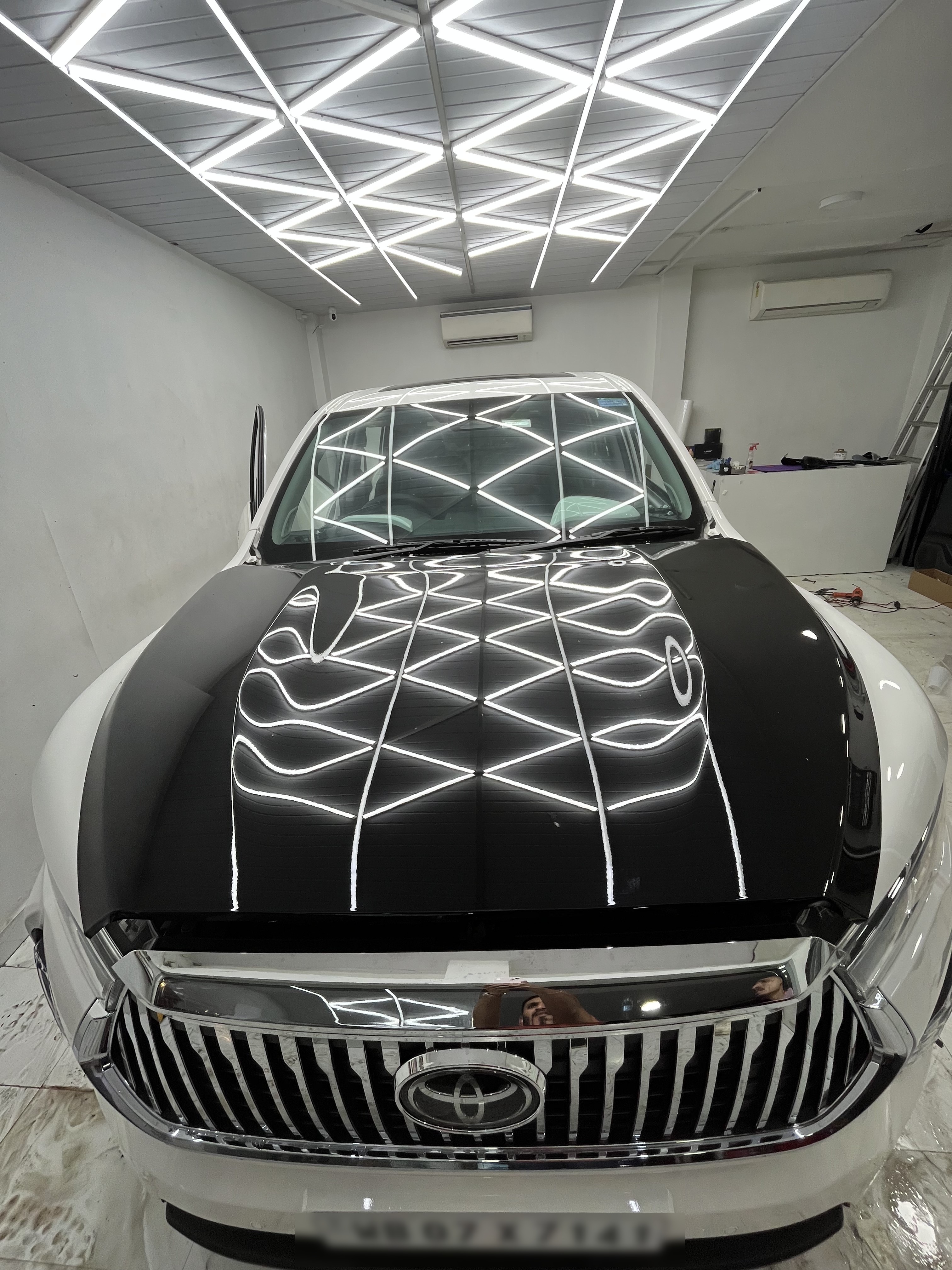 Toyota Fortuner paint correction gloss check under studio lighting at BP Wraps