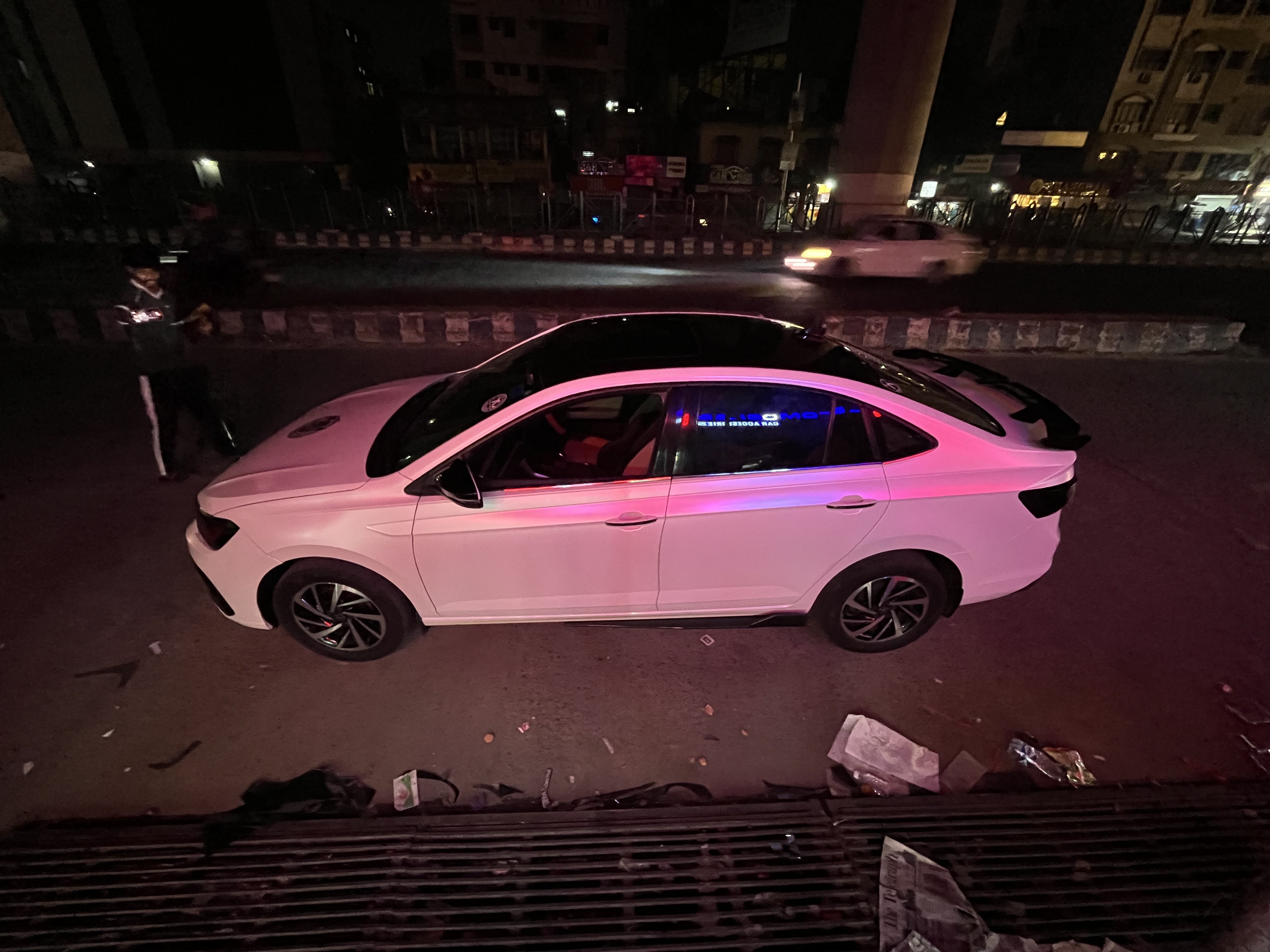 Volkswagen Virtus sedan in white with gloss ceramic coating at BP Wraps Kolkata