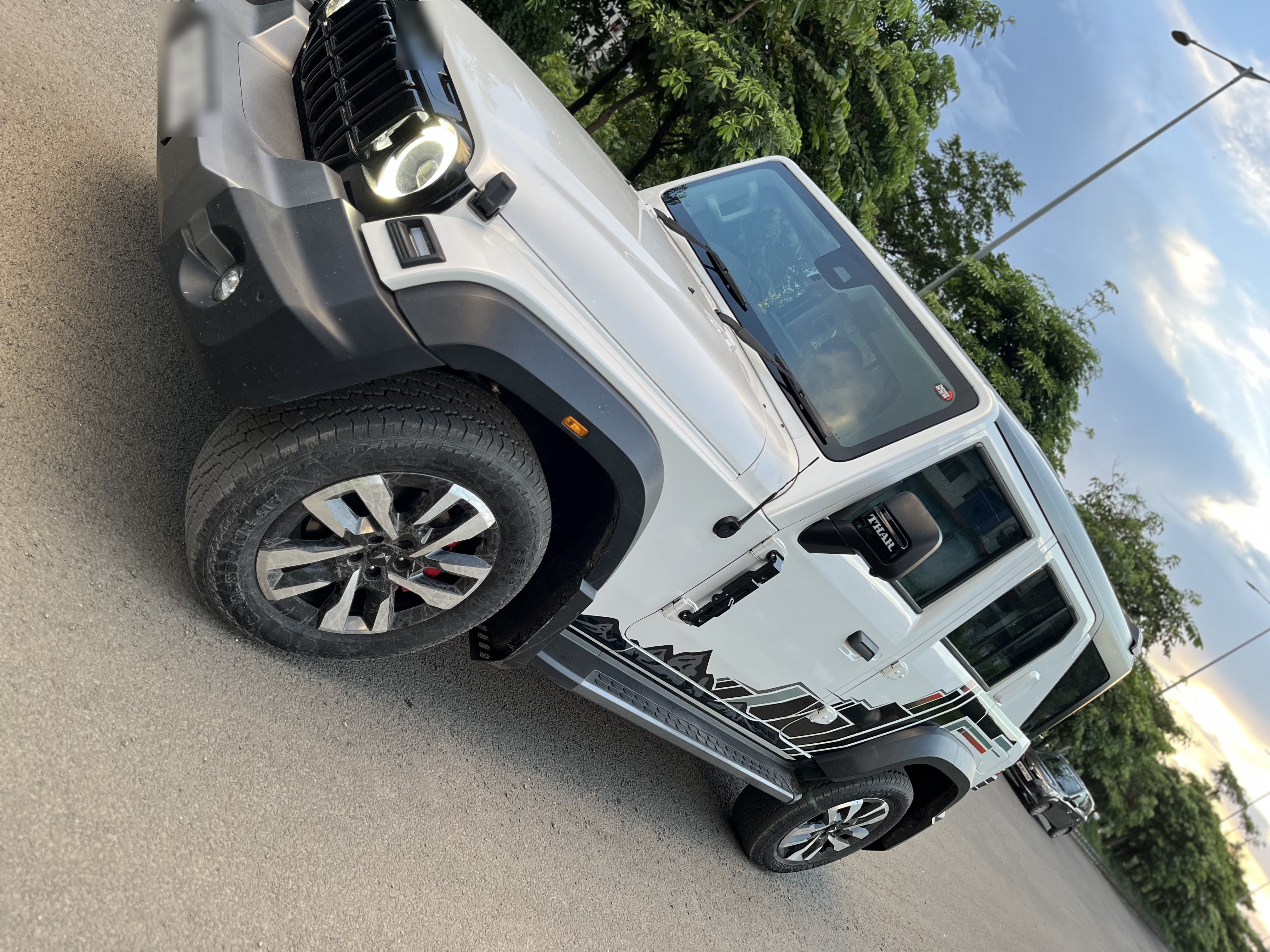 Mahindra Thar Roxx in white with custom side graphics by BP Wraps